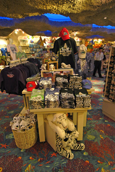 Shelves of t-shirts and hats